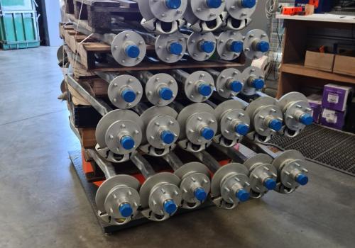 Finished trailer axles with hub assemblies attached